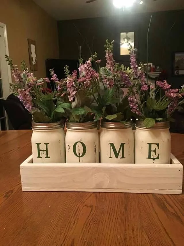 DIY Farmhouse Mason Jar Centerpiece Spelling HOME with Flowers.