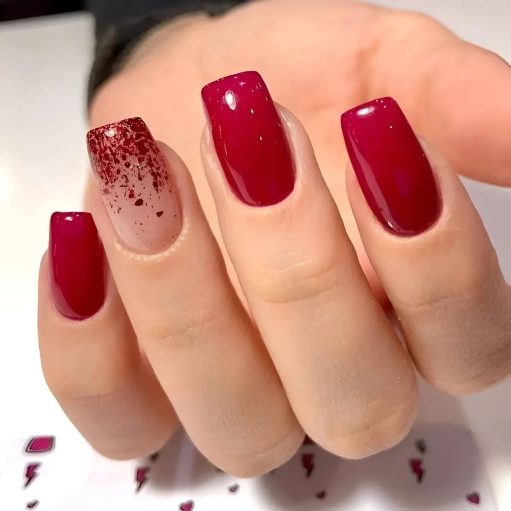 Deep red square nails with a sheer glitter accent for a bold and modern look.