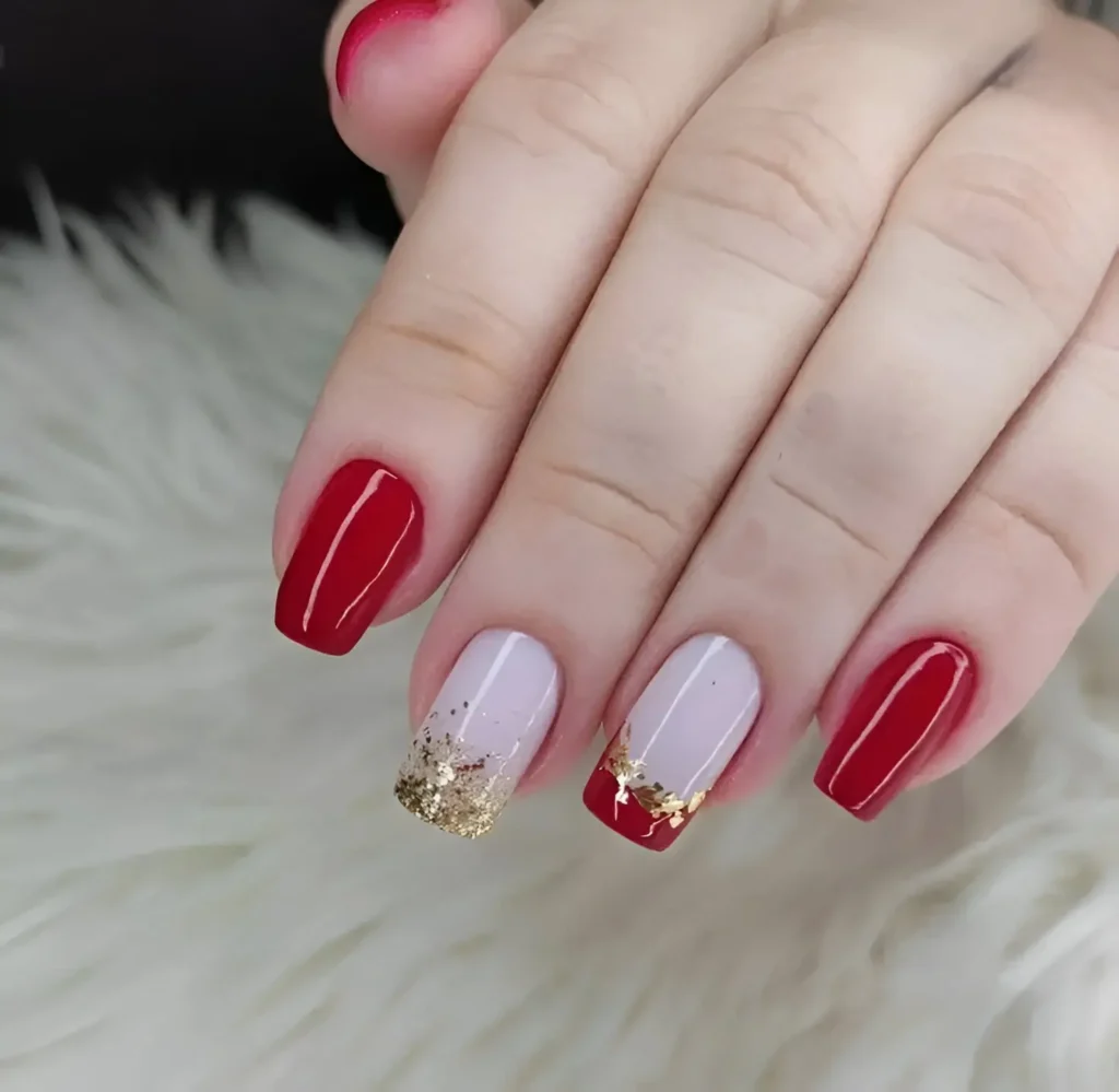 Red and gold glitter nails with a modern square shape for an elegant look.