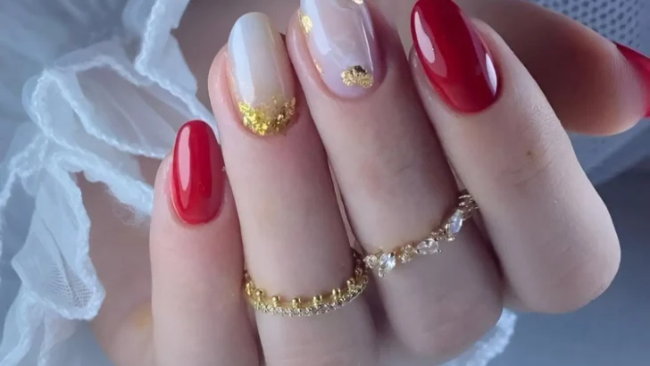 Red and sheer nails with gold foil for an elegant and artistic manicure. Trendy Red Nail Designs