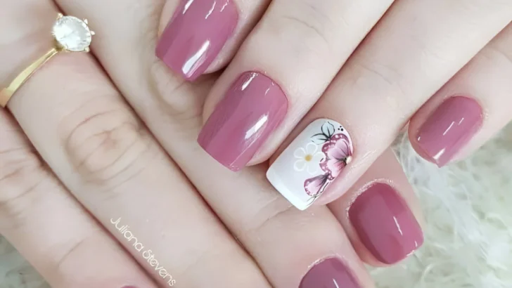 Classy mauve nails with hand-painted floral accent nail designs.