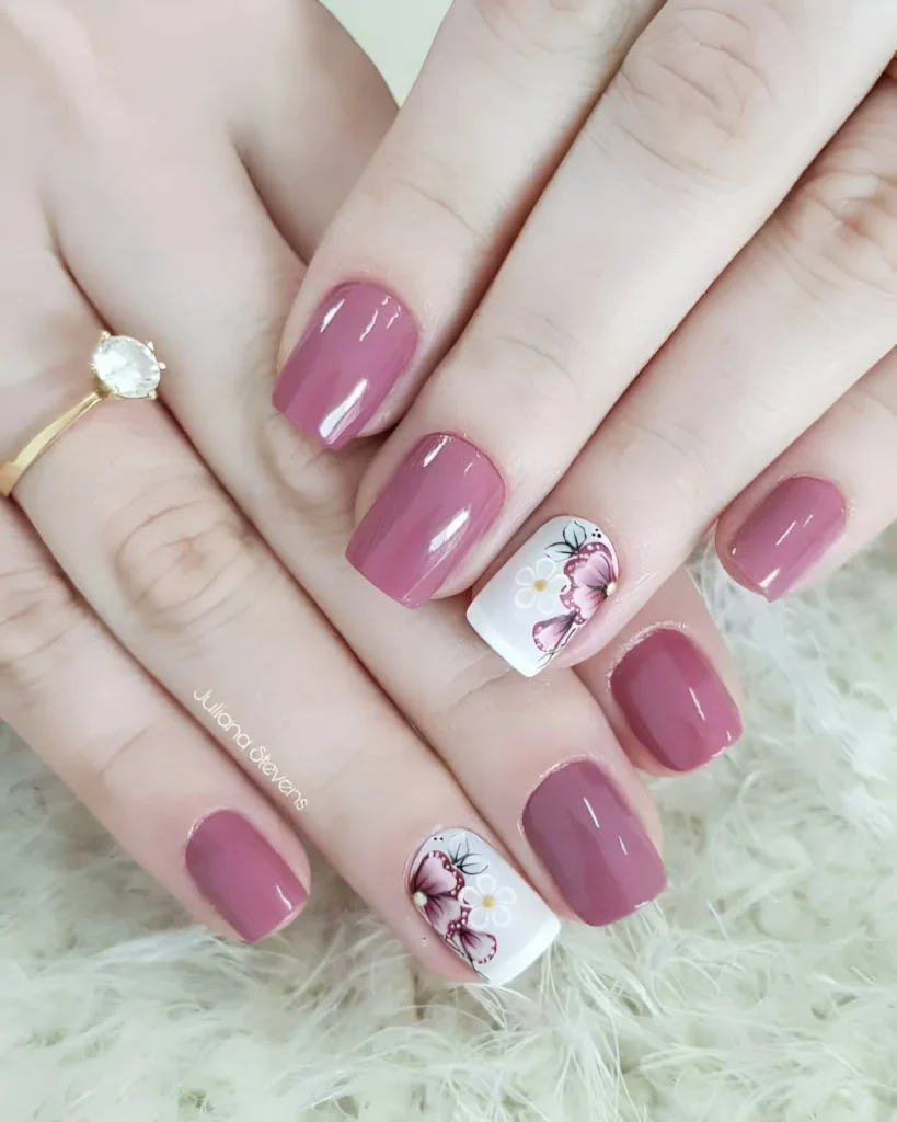 Classy mauve nails with hand-painted floral accent nail designs.