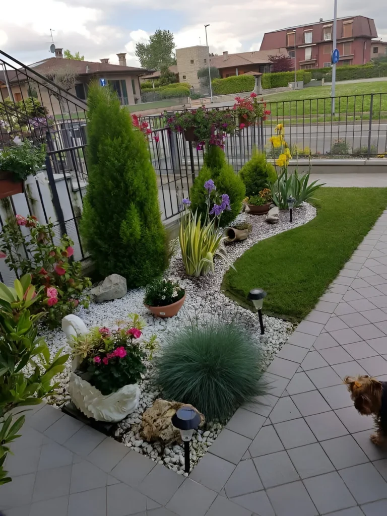 Garden decor featuring a rock garden with a variety of plants, rocks, and landscape lighting.