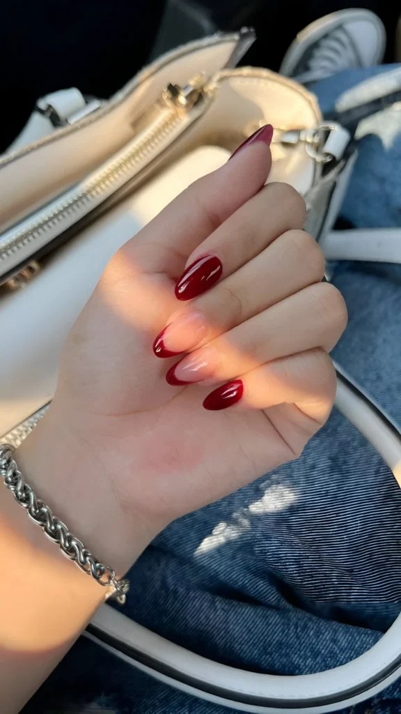 Minimalist burgundy French tip nails with a glossy finish.