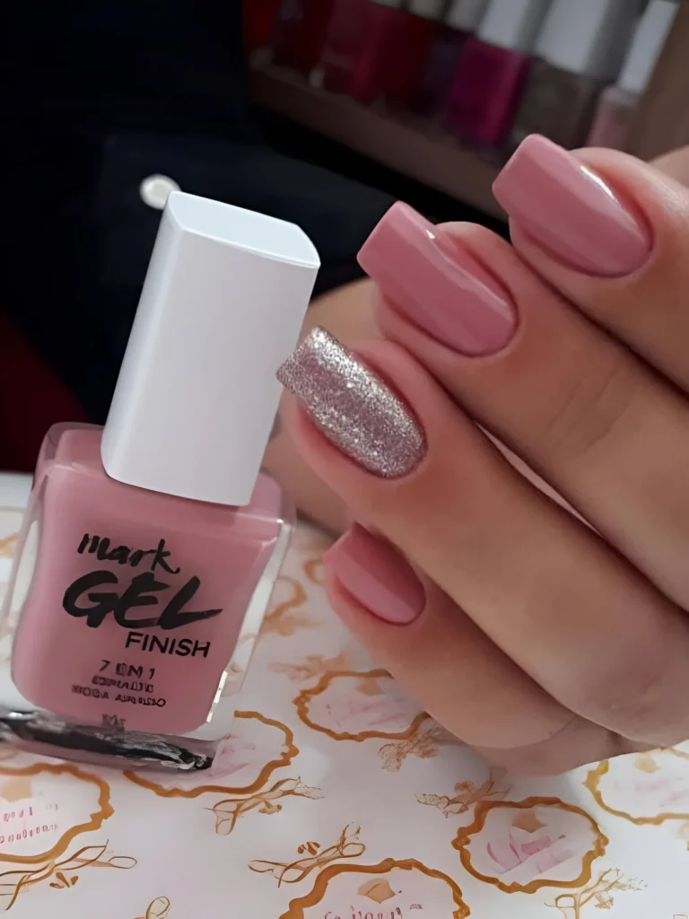 Dusty rose nails with a silver glitter accent nail.