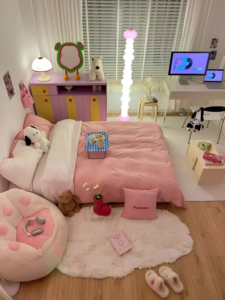 Small bedroom featuring a pink and yellow cabinet, a pink beanbag chair, and pink bedding, contrasting with the otherwise neutral color scheme.